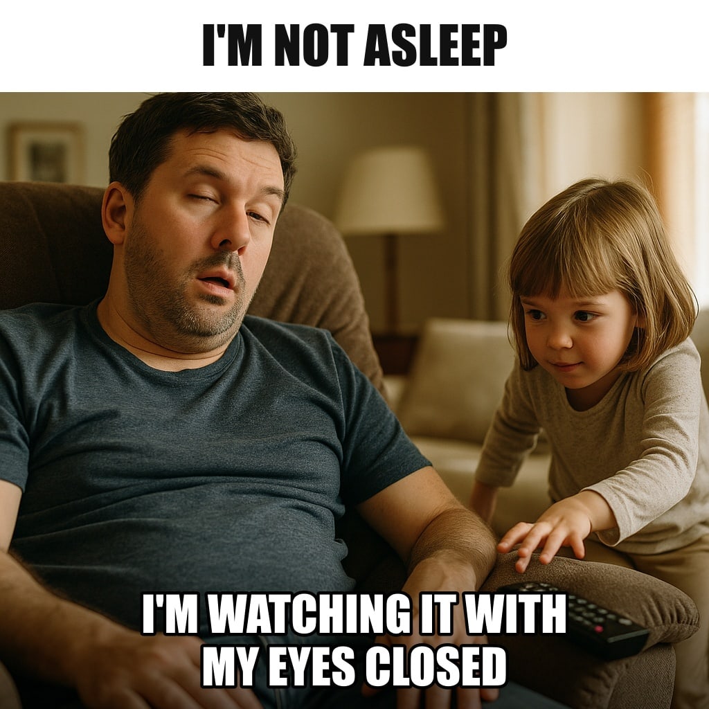 A dad asleep in a recliner in a cozy living room, mouth slightly open, but one eye cracked open suspiciously as a small child tiptoes toward the TV remote on the armrest. Caption: "I'm not asleep I'm watching it with my eyes closed"