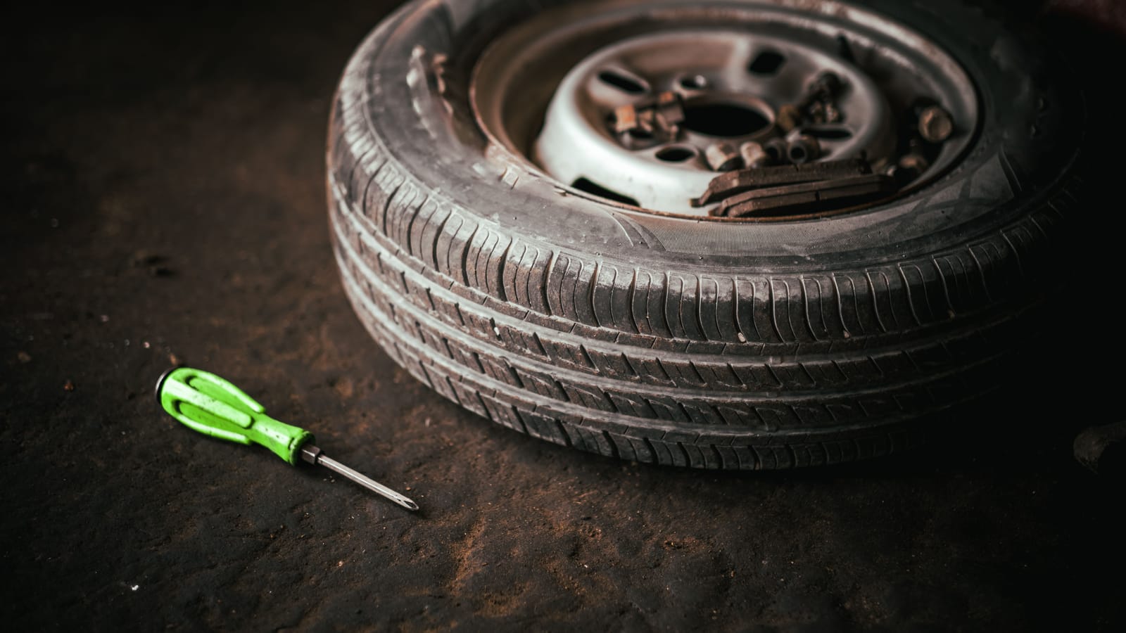 Changing a tire in the dark and the rain